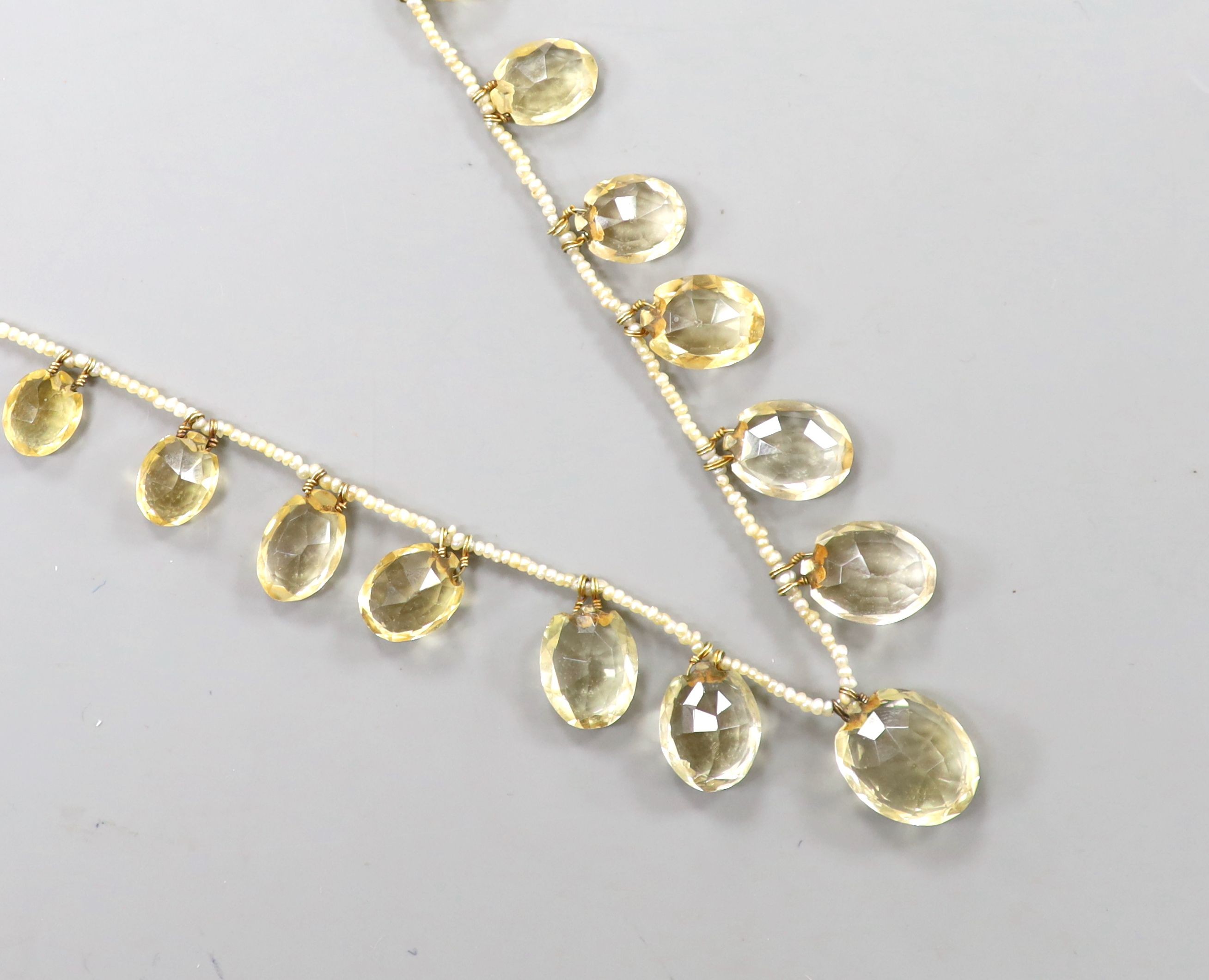 A 19th century citrine and seed pearl set fringe necklace, with yellow metal clasp, 40cm.